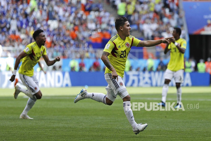 Pemain Kolombia Juan Quintero merayakan  gol ke gawang Jepang di Saransk, Rusia, Selasa (19/6).   