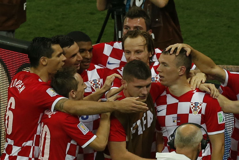 Pemain Kroasia melakukan selebrasi usai menjebol gawang Kamerun di laga Grup A Piala Dunia 2014 Brasil di Arena Amazonia, Manaus, pada 18 Juni. 