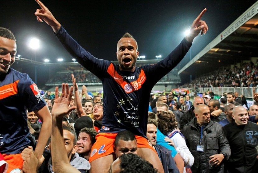 Pemain Montpellier, Garry Bocaly merayakan gelar juaga liga Prancis 2011/2012