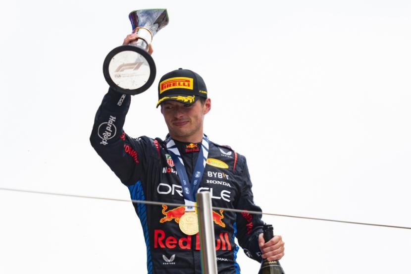 Pembalap Red Bull Max Verstappen merayakan gelar juara GP Spanyol di Sirkuit Barcelona-Catalunya, Ahad (23/6/2024)