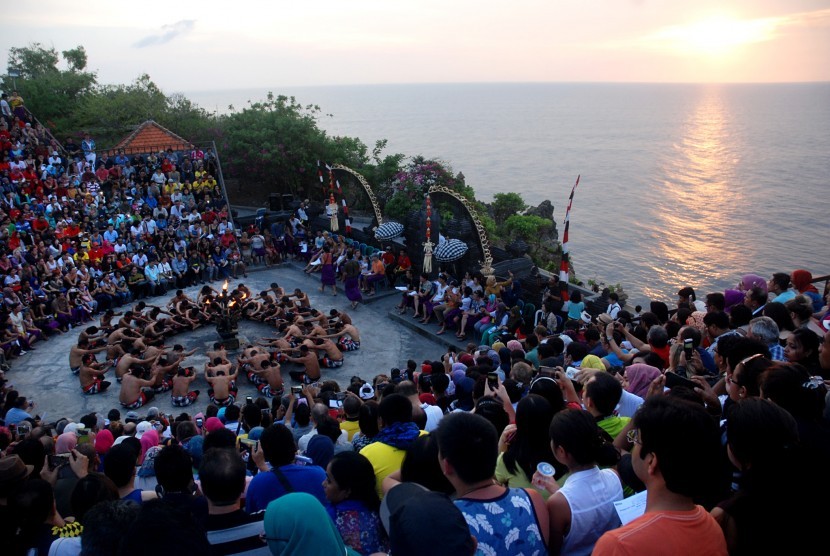 Visitors watched the performance of Kecak dance at Luhur Temple Uluwatu, Bali.