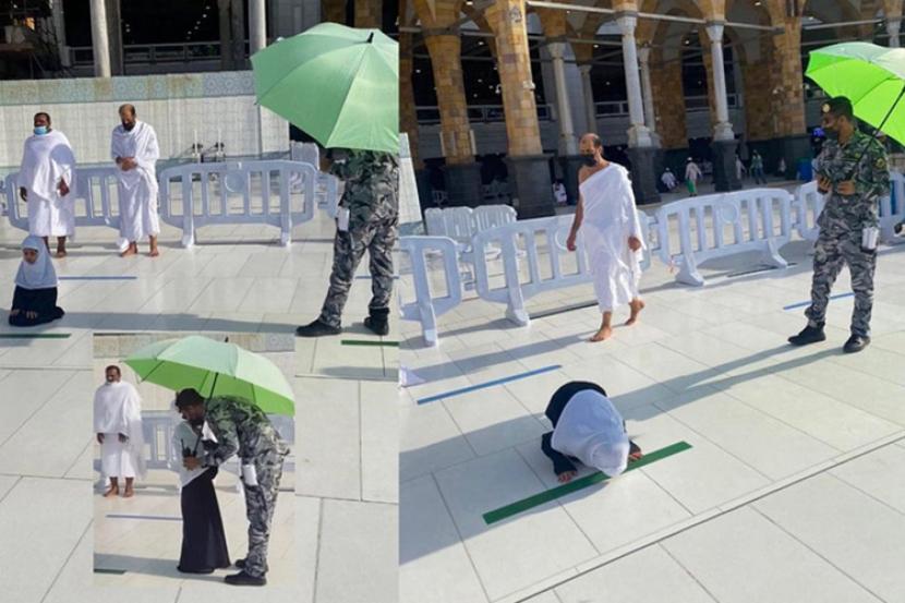 Petugas keamanan Masjidil Haram melindungi gadis cilik sholat dari terik matahari 