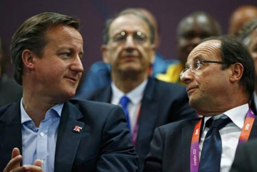 Perdana Menteri Inggris David Cameron dan Presiden Prancis Francois Hollande