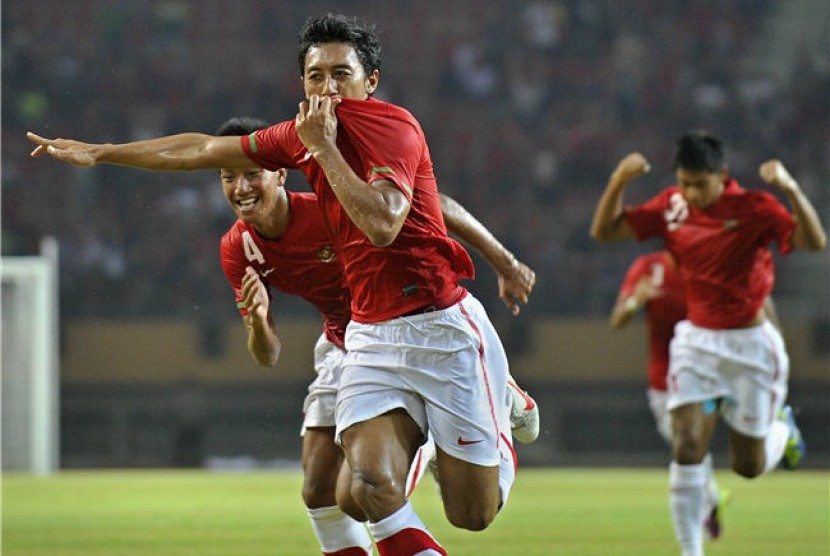  Pesepakbola Indonesia, Nurmufid, melakukan selebarasi usai mencetak gol ke gawang Timor Leste dalam pertandingan kualifikasi Grup E Piala Asia (AFC) di Pekanbaru, Riau, Sabtu (7/7) malam. 