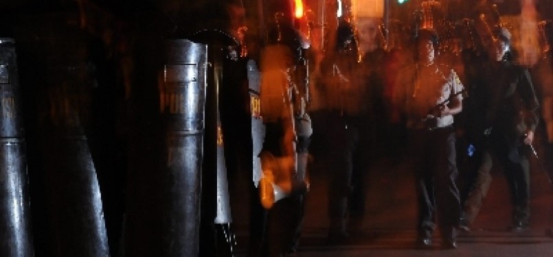 Police raid 19 students involved in a protest, after they blokade the street and rejected the dismissal order in Salemba, Jakarta. 