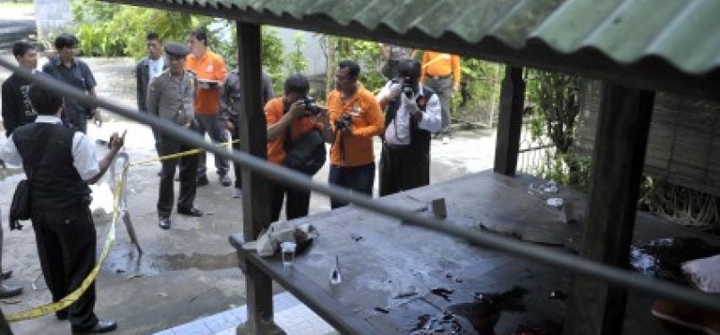 Police investigate the crime scene where five suspected terrorists killed in Denpasar, Bali, on Monday. 
