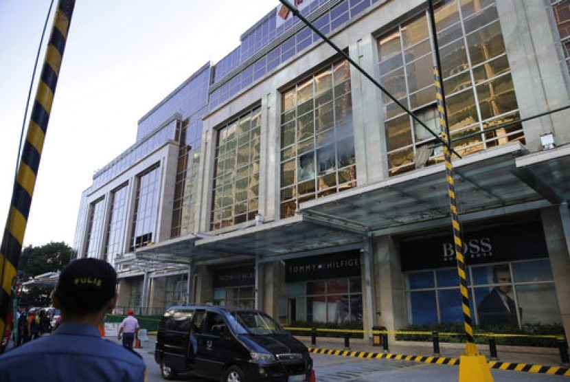 Smoke rose from the Resort World Manila building on Friday as gunmen attack the hotel.