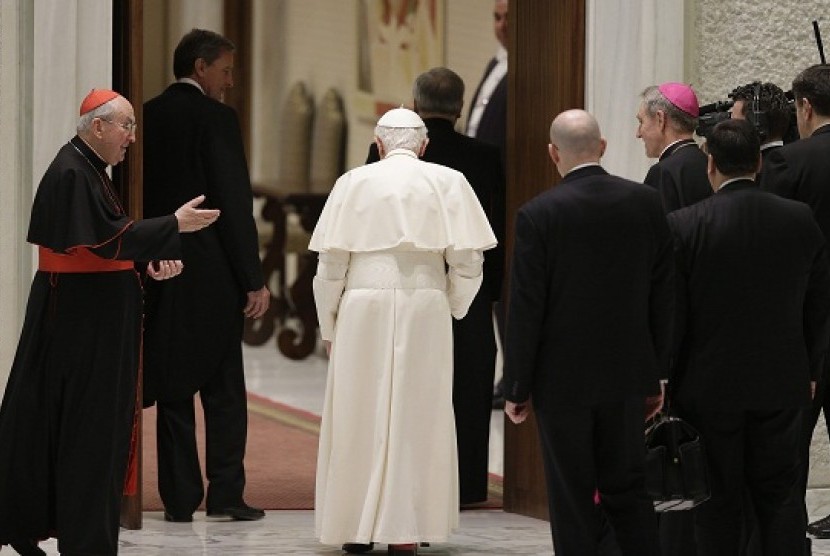 Pope Benedict XVI leaves at the end of a special audience with priests of the Diocese of Rome in Paul VI's hall at the Vatican February 14, 2013. 