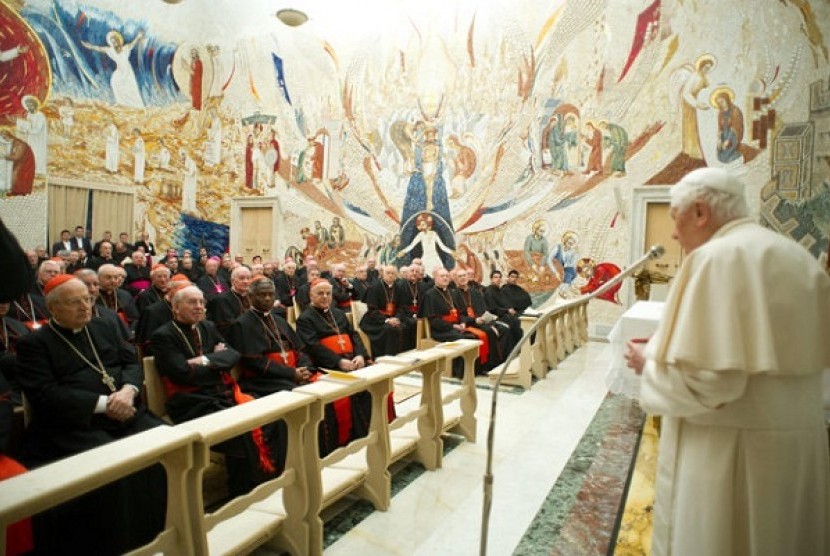 Pope Benedict XVI (right) delivers his message concluding a weeklong spiritual retreat, at the Vatican, Saturday, Feb. 23, 2013. 