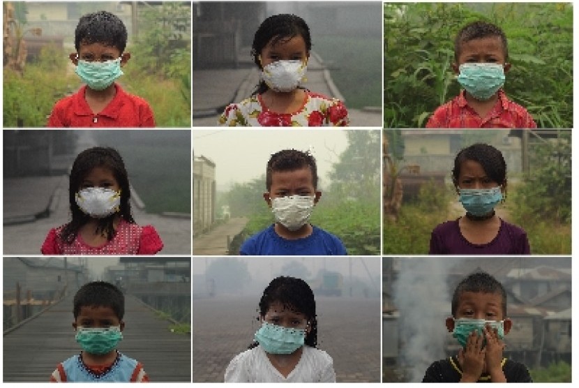 Potret anak-anak mengenakan masker selama kabut asap di Kalimantan.
