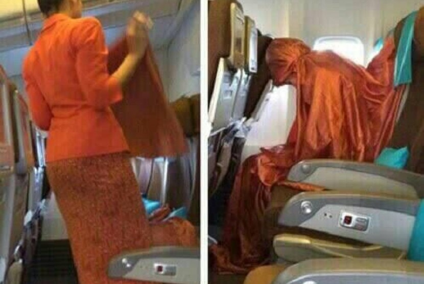 Pramugari Garuda Indonesia shalat di dalam pesawat