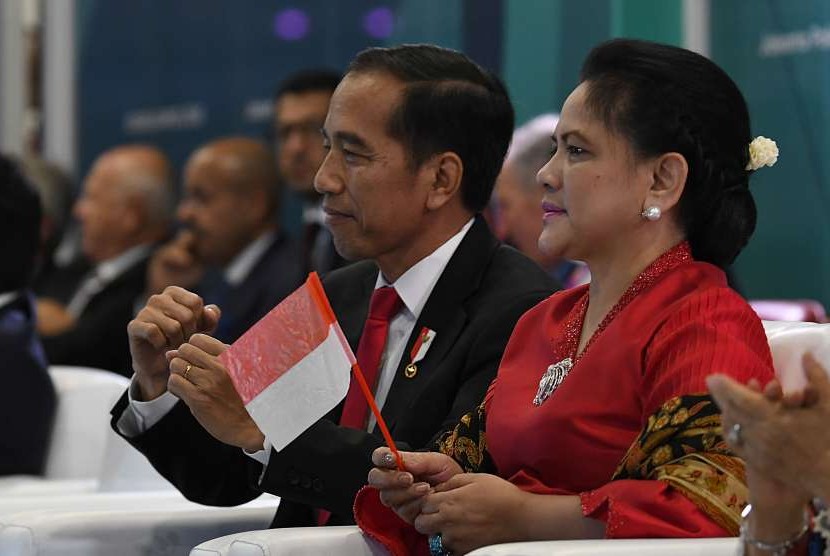 President Joko Widodo (second right) and First Lady Iriana Joko Widodo attend opening ceremony of the 18th Asian Games at Gelora Bung Karno Main Stadium, Jakarta, Saturday.