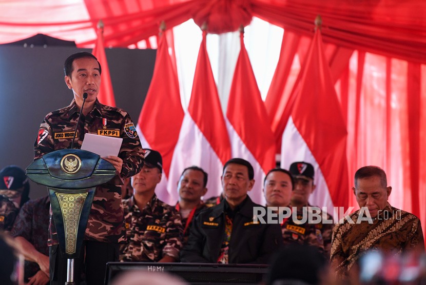 President Joko Widodo delivers a speech when   during the opening of the National Jamboree of the Indonesian National Police's Son Daughter Communication Forum (FKPPI) at Ragunan Campground, Jakarta, Friday.