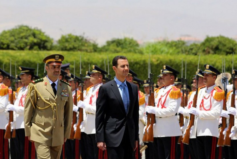 Presiden Suriah Bashar al Assad (kanan)