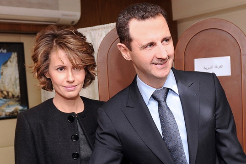 Presiden Suriah Bashar Al-Assad (kanan) dan istrinya Asma Al-Assad (kiri).