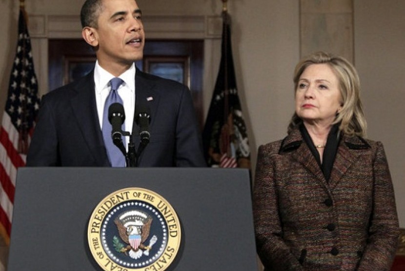 President Barack Obama, with Secretary of State Hillary Rodham Clinton at right, speaks about Libya in the Grand Foyer of the White House in Washington. Obama now has a freer hand to deal with a world of familiar problems in fresh ways. Clinton has announc