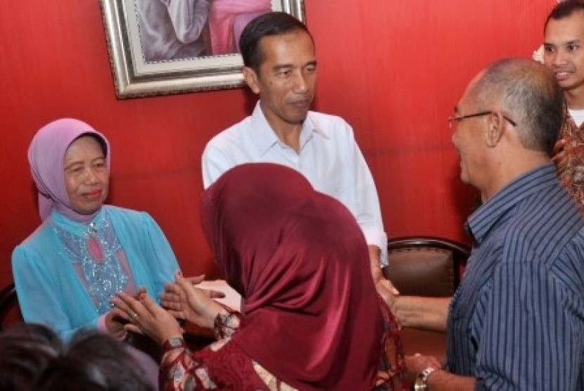 President-elect Joko Widodo (in white) holds an open house in his hometown in Solo on Wednesday.