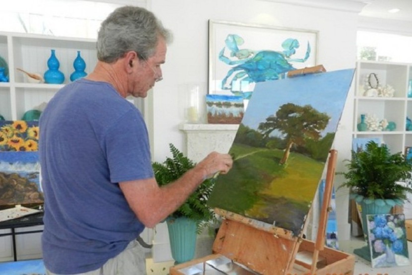 President George W. Bush works on one of his oil paintings in this picture dated on January. 