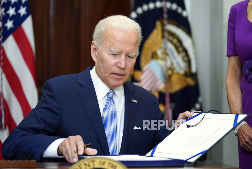 President Joe Biden signs into law S. 2938, the Bipartisan Safer Communities Act gun safety bill, in the Roosevelt Room of the White House in Washington, June 25, 2022. Republican support for gun restrictions is slipping a year after Congress passed the most comprehensive firearms control legislation in decades with bipartisan support, according to a poll from The Associated Press-NORC Center for Public Affairs Research.