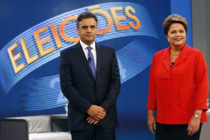 Presidential candidates Aecio Neves of Brazilian Social Democratic Party (PSDB) and Dilma Rousseff of Workers Party (PT) pose before a television debate in Rio de Janeiro October 24, 2014.