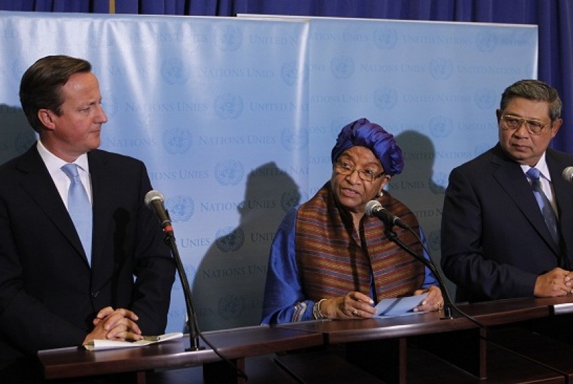 Prime Minister David Cameron of the United Kingdom (left) and President Susilo Bambang of Indonesia look on as President Ellen Johnson-Sirleaf of Liberia speaks during a news conference regarding a meeting of the Secretary-General's high level panel on pos