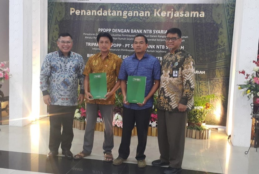 PT Sarana Multigriya Finansial (Persero) melaksanakan penandatanganan kerja sama penyaluran KPR iB SMF Pasca Bencana kepada ASN dengan Bank NTB Syariah, serta kerja sama Tripatrit antara SMF, BLU PPDPP, Bank NTB Syariah terkait penyaluran Dana KPR FLPP Sejahtera yang berlangsung pada hari ini,  Kamis (28/2) di Lombok, NTB.