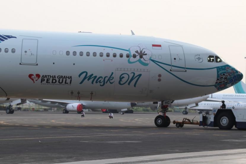 Rancangan berupa masker di hidung pesawat Garuda Indonesia hasil kolaborasi dengan yayasan Artha Graha Peduli.