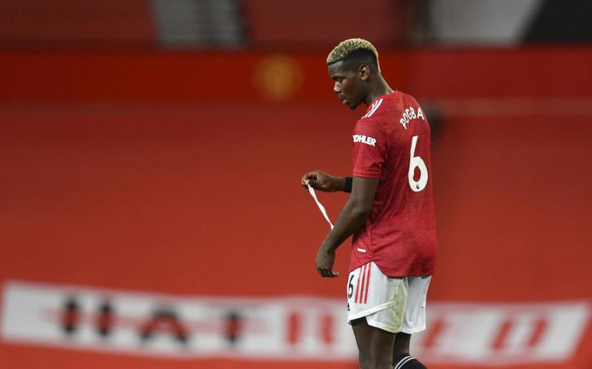 Reaksi Gelandang Manchester United, Paul Pogba pada laga Liga Primer Inggris melawan Arsenal di Old Trafford, Senin (2/11) dini hari WIB. United kalah 0-1.