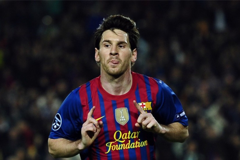 Reaksi Lionel Messi (FC Barcelona) setelah mencetak gol ke gawang AC Milan, di Camp Nou, Barcelona, Spanyol, Selasa (3/4). (Foto: AP/Manu Fernandez) 