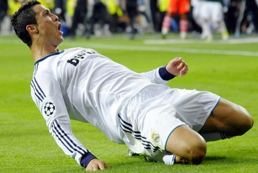 Real Madrid's Cristiano Ronaldo celebrates after scoring a goal against Manchester City during their Champions League Group D soccer match at Santiago Bernabeu stadium in Madrid September 18, 2012. And a scientist says that science could help Indonesia to 