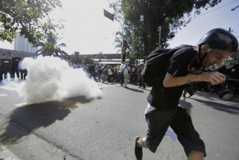Riot policemen fire tear gas against demonstrators during a protest against the 2014 World Cup in Sao Paulo June 12, 2014. 