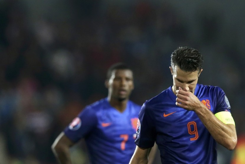 Robin van Persie of the Netherlands reacts after the Euro 2016 qualifying soccer match against the Czech Republic in Prague September 9, 2014.