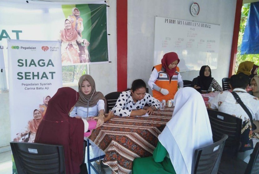 Rumah Zakat dan Pegadaian Syariah Carina Batu Aji mengadakan layanan pemeriksaan kesehatan gratis. 