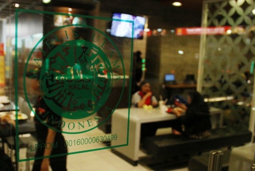 A restaurant in Jakarta with a halal certificate sticker in its mirror. 