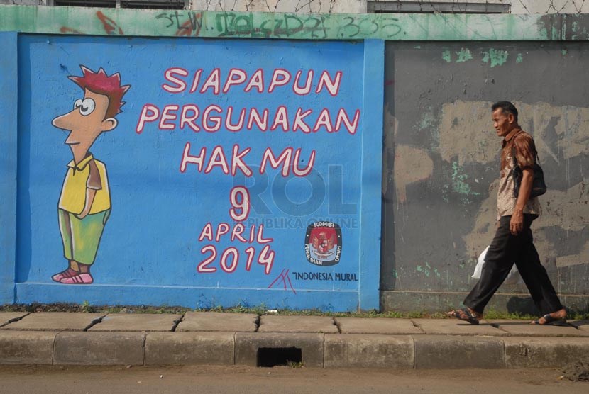 Sebuah mural bertemakan pemilu bertuliskan 