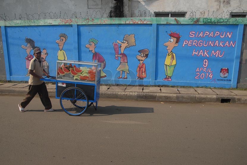 Sebuah mural bertemakan pemilu bertuliskan 