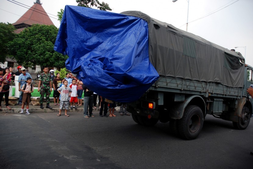 The wreckage of Bravo 202, an airplane with two side by side seats, is loaded into a military truck in Bandung, West Java, on Saturday.  