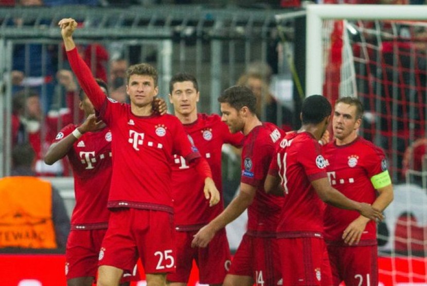 Selebrasi pemain Bayern Muenchen usai membobol gawang Arsenal.