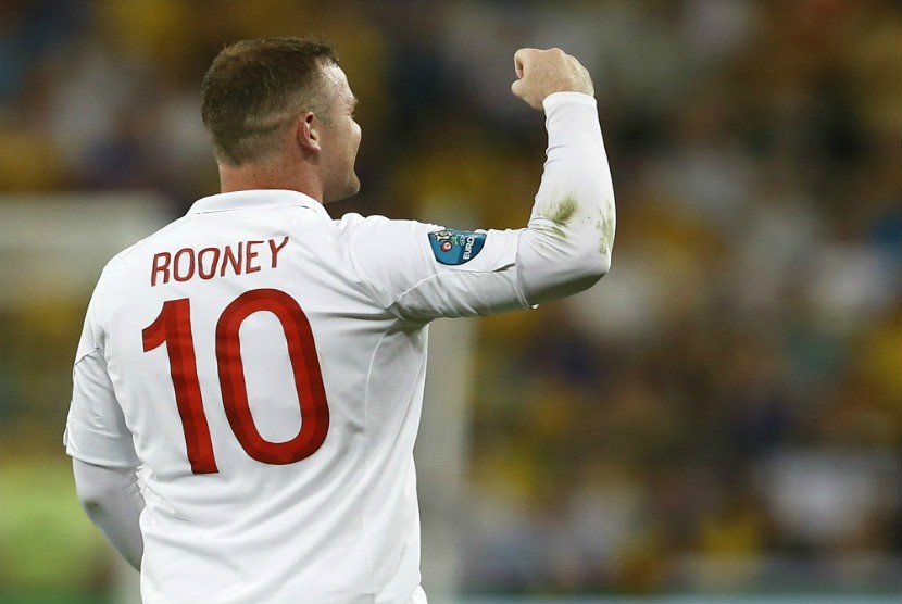  Selebrasi pemain Inggris Wayne Rooney usai mencetak gol ke gawang Ukrania. (Kirsty Wigglesworth/AP)