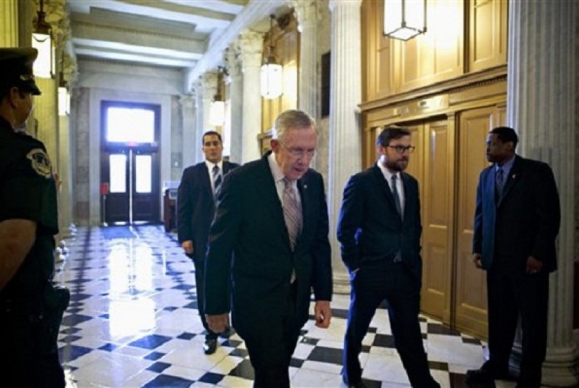 Senate Majority Leader Harry Reid of Nev. makes his way to the Senate floor on Capitol Hill in Washington, Friday, Sept. 6, 2013, to introduce a resolution to authorize military action to support President Barack Obama's request for a strike against Syria.