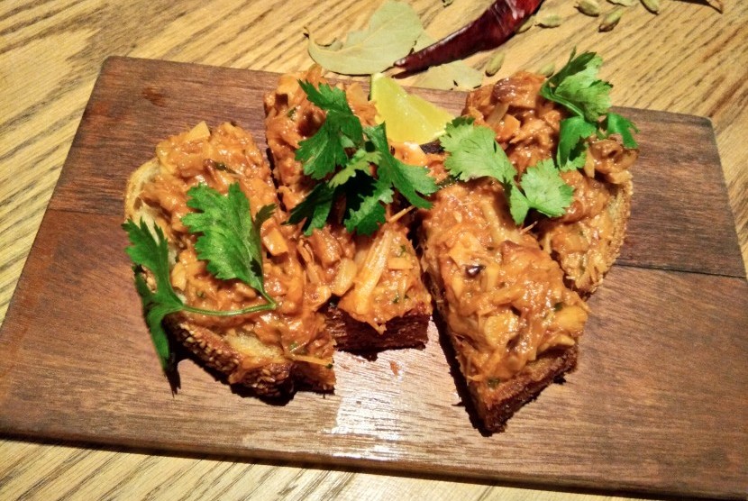 Slow Cooked Young Jackfruit in Citrus BBQ Sauce on Sourdough Toast.