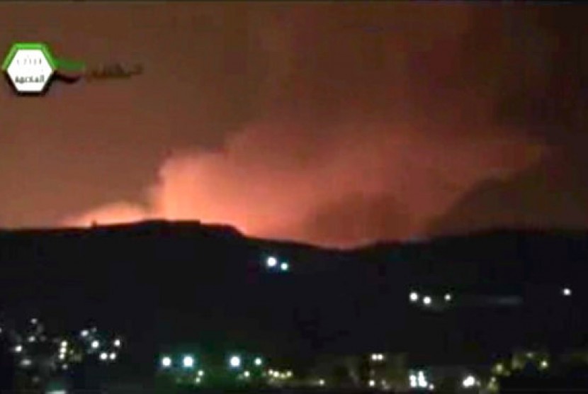 Smoke and fire fill the the skyline over Damascus, Syria, early Sunday, May 5, 2013 after an Israeli airstrike. 