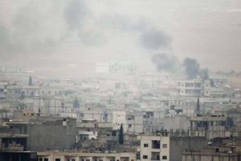 Smoke rises from the Syrian town of Kobani, on Oct, 17, 2014.