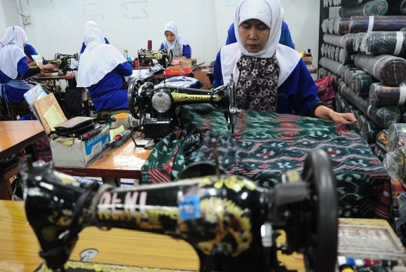 Some workers are sewing in a textile manufacture in tegal, Central Java. Indonesian government needs to work harder to tackle unemployment in this country. (illustration)   