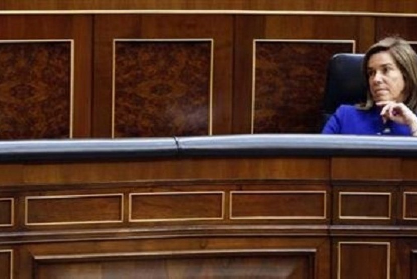 Spain's Health Minister Ana Mato listens Prime Minister Mariano Rajoy's speech during State of the Nation debate at Parliament in Madrid February 20, 2013. 