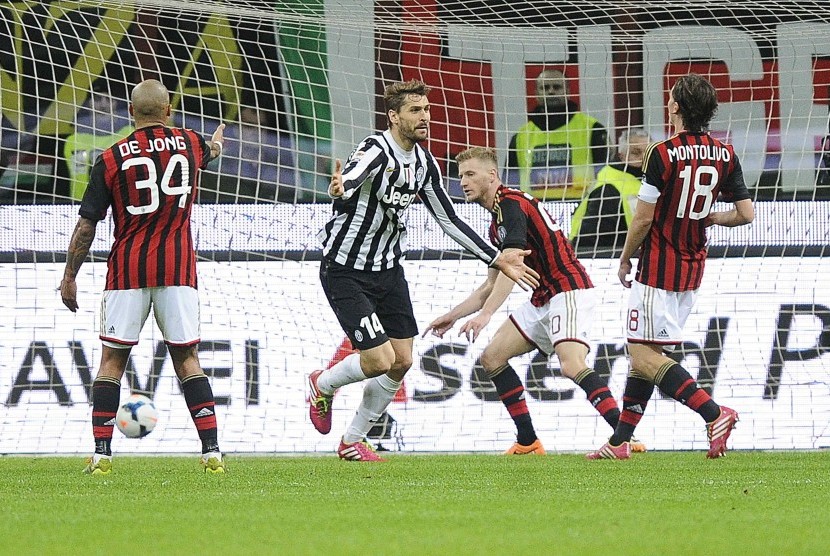 Striker Juventus Fernando Llorente (tengah) sesaat setelah menjebol gawang AC Milan.