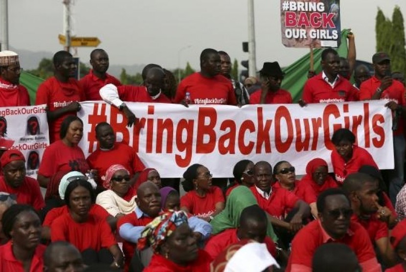 The Abuja wing of the 'Bring Back Our Girls' protest group prepare to march to the presidential villa on May 22, 2014.