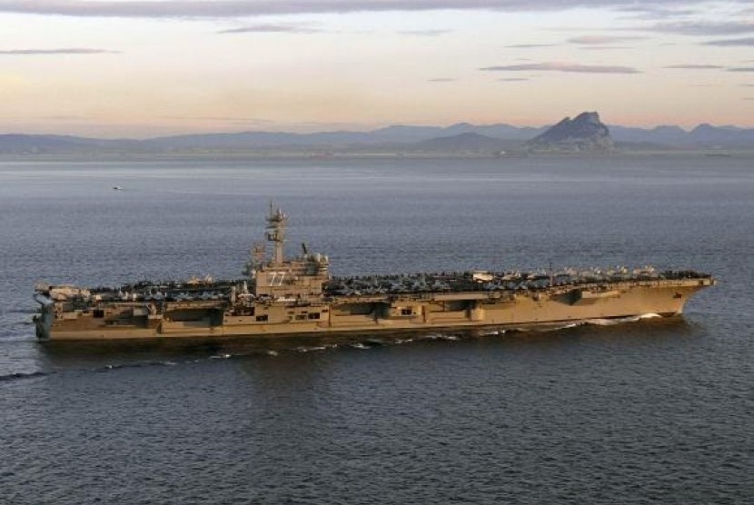 The aircraft carrier USS George HW Bush transits the Strait of Gibraltar into the Mediterranean Sea in this February 27, 2014 picture provided by the US Navy.