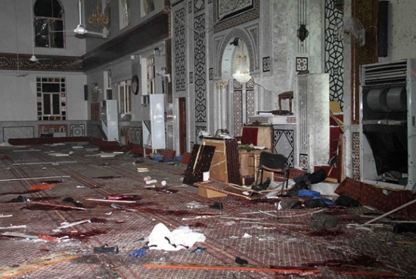 the Eman Mosque is seen destroyed after a suicide bomber blew himself up, killing Sheikh Mohammad Said Ramadan al-Buti, an 84-year-old cleric in Damascus, Syria, Thursday, March 21, 2013.