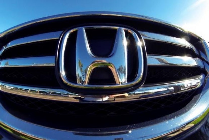 The front grill of a Honda truck is shown on car lot in Carlsbad, California November 5, 2014.